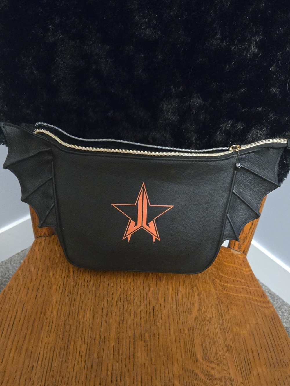 Jeffree Star Black Cosmetic Bag with Orange Star Accent